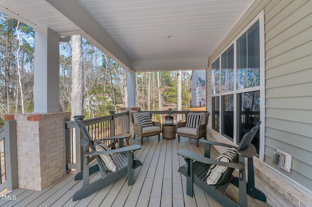 wooden terrace featuring a porch