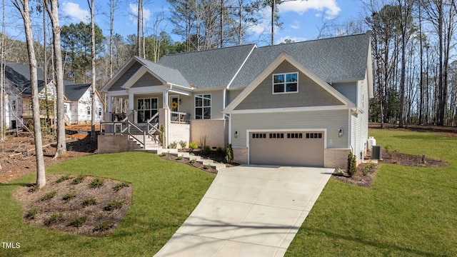 112 Rawhide Dr, Louisburg, NC 27549 - craftsman-style home with driveway, a front yard, roof with shingles, a porch, and central AC
