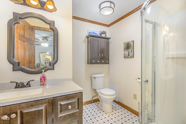 bathroom featuring vanity, baseboards, ceiling fan, ornamental molding, and toilet
