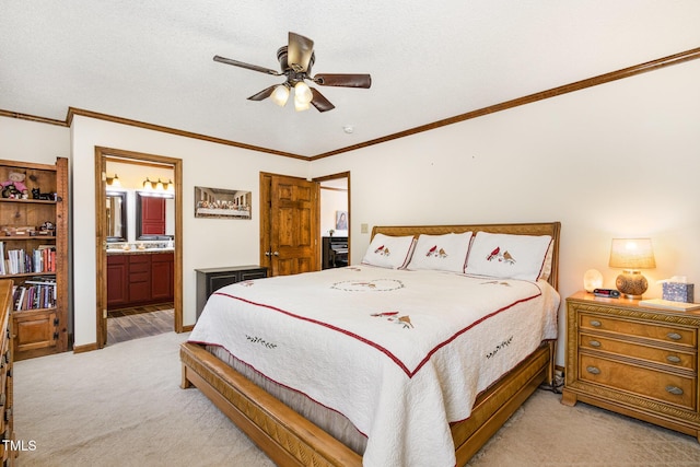bedroom with a ceiling fan, light colored carpet, ensuite bathroom, and ornamental molding