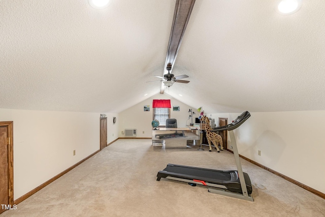 exercise area featuring vaulted ceiling, baseboards, and carpet floors