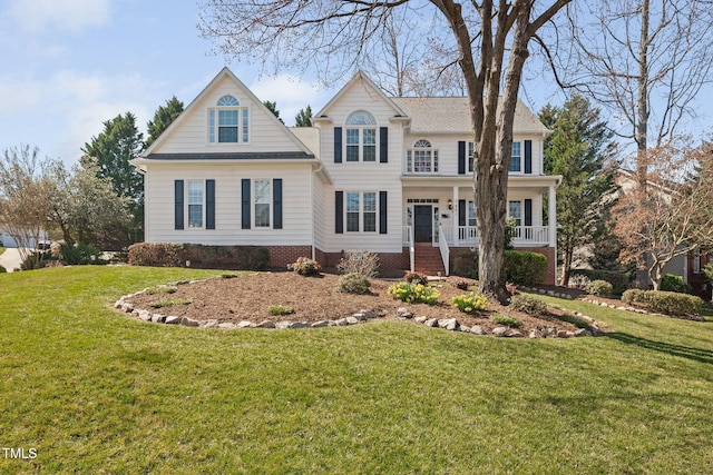 view of front of house featuring a porch and a front lawn