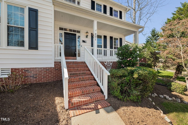 property entrance featuring covered porch