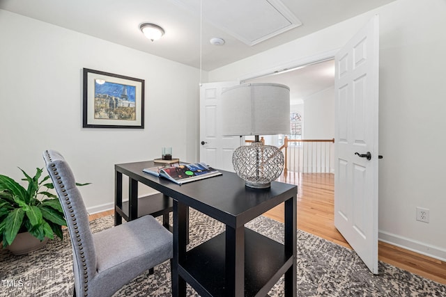 office featuring baseboards and wood finished floors