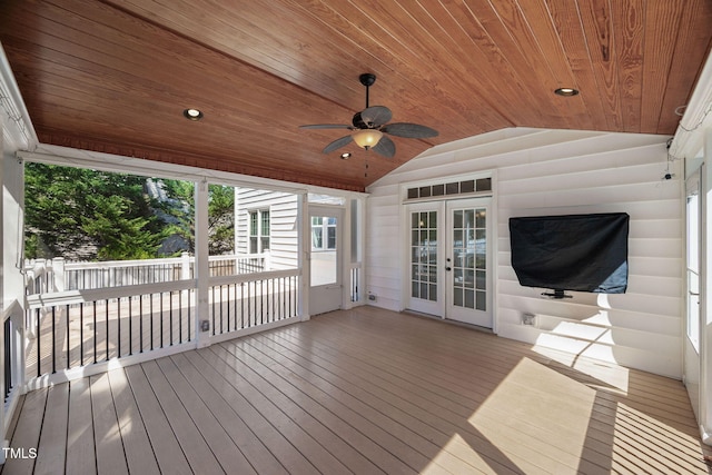 wooden deck featuring french doors and ceiling fan