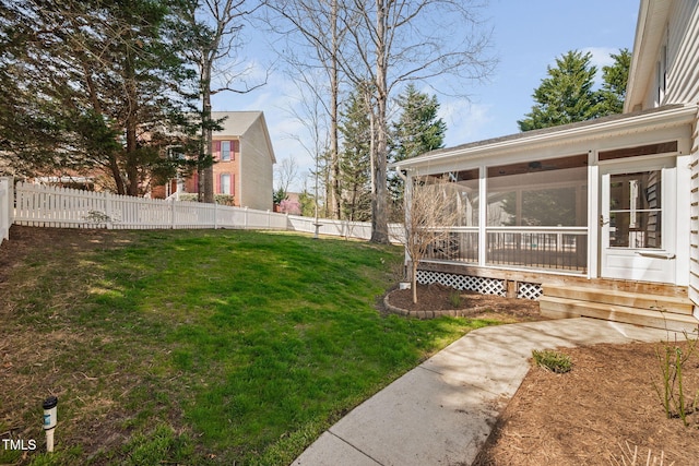 view of yard featuring a fenced backyard and a sunroom