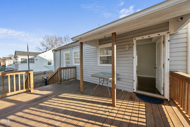 wooden terrace with a residential view