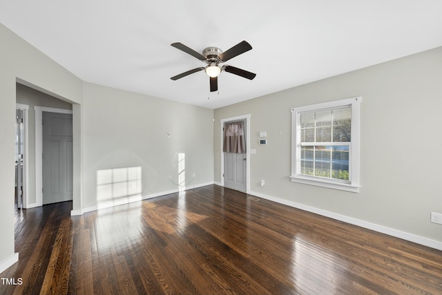 unfurnished room featuring a ceiling fan, baseboards, and hardwood / wood-style floors