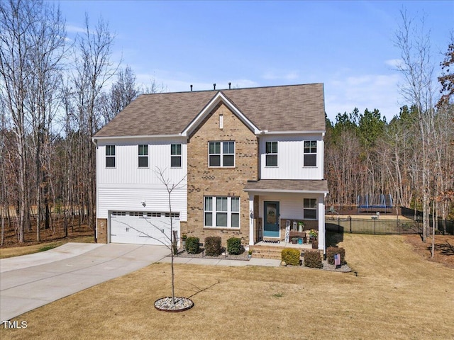 view of front of property featuring a front lawn, fence, a porch, concrete driveway, and a garage