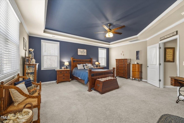 bedroom featuring baseboards, visible vents, carpet floors, a tray ceiling, and ornamental molding