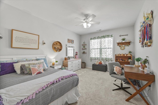 bedroom featuring visible vents, baseboards, ceiling fan, and carpet floors