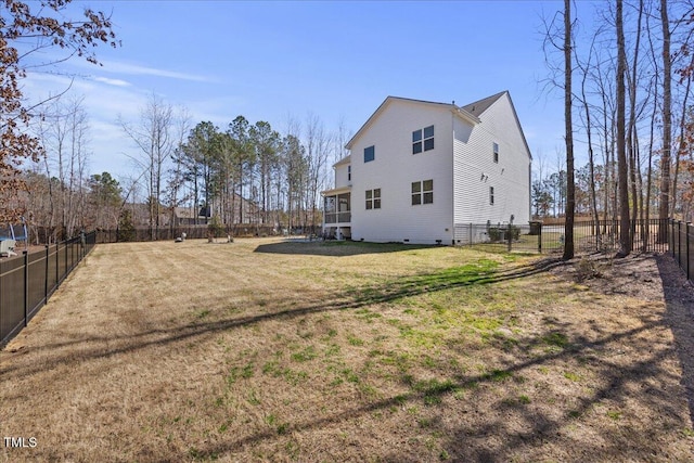 back of property with a yard and a fenced backyard