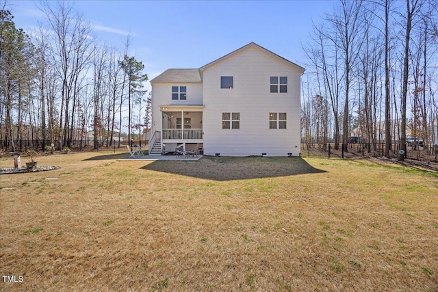 back of house with a yard and fence