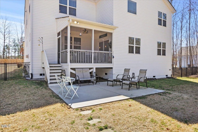 back of house featuring a patio, fence, a sunroom, crawl space, and a lawn