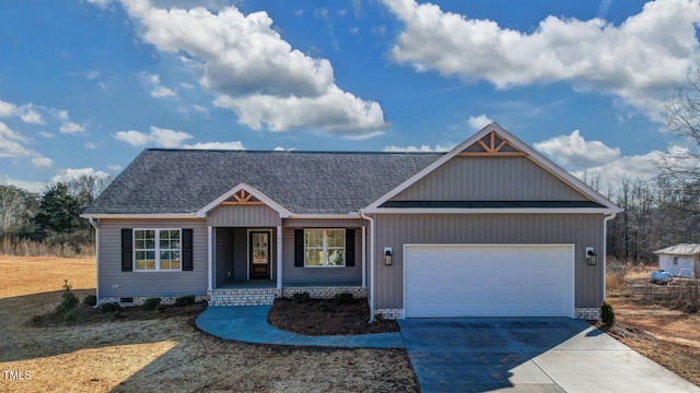 view of front of house with driveway, a shingled roof, an attached garage, covered porch, and crawl space