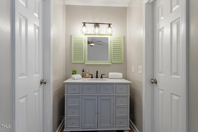 bathroom with vanity and baseboards