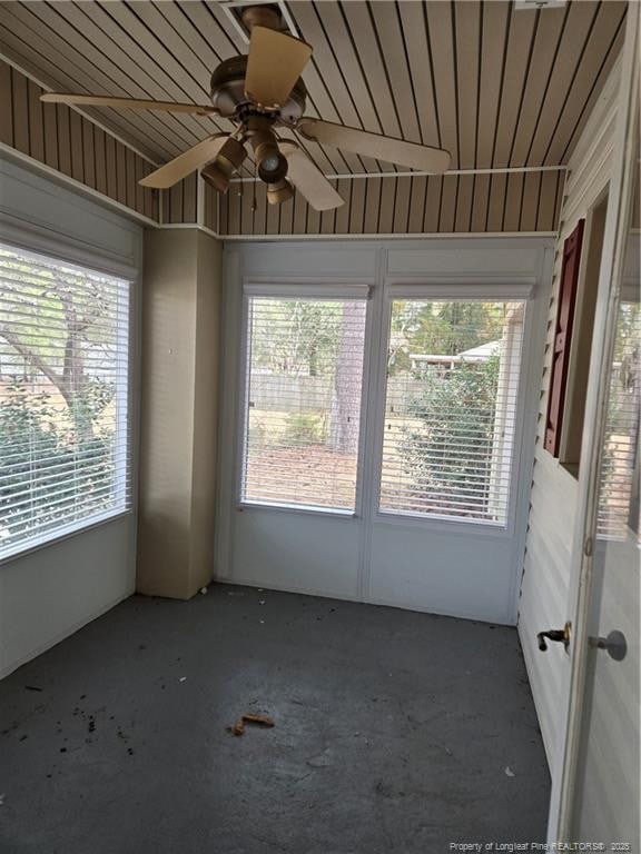 interior space with ceiling fan