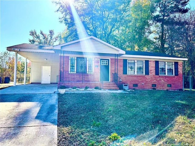 ranch-style home featuring a carport, crawl space, brick siding, and concrete driveway