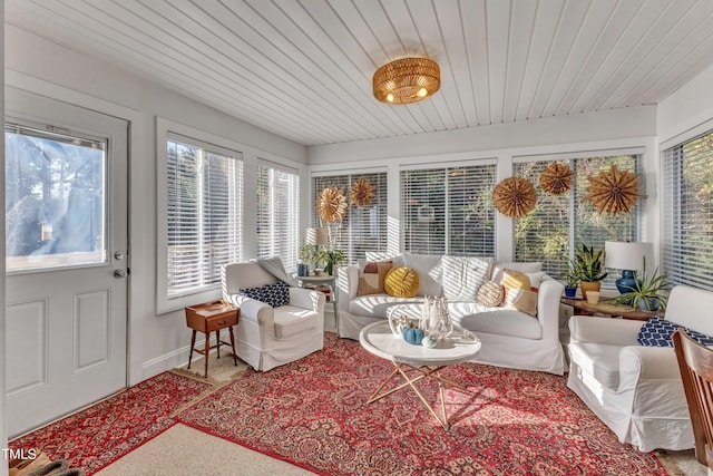 sunroom featuring wood ceiling