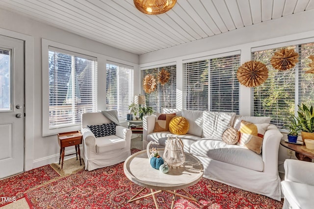 sunroom / solarium featuring wood ceiling