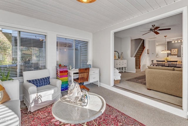 sunroom / solarium with a ceiling fan