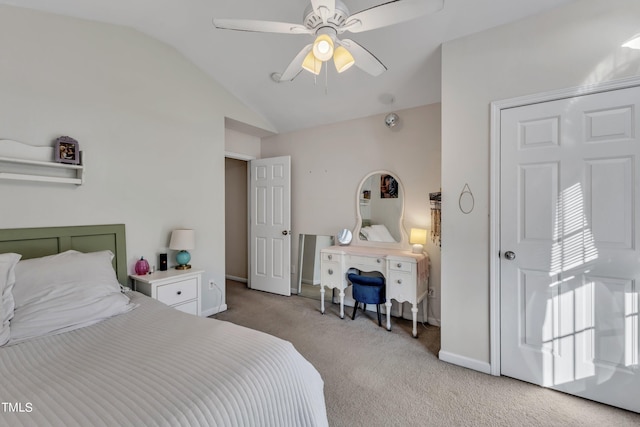 carpeted bedroom featuring lofted ceiling, ceiling fan, and baseboards