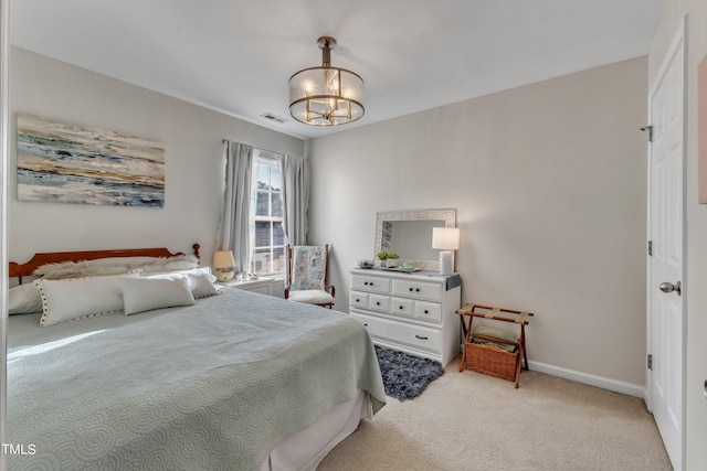 bedroom with light carpet, an inviting chandelier, baseboards, and visible vents