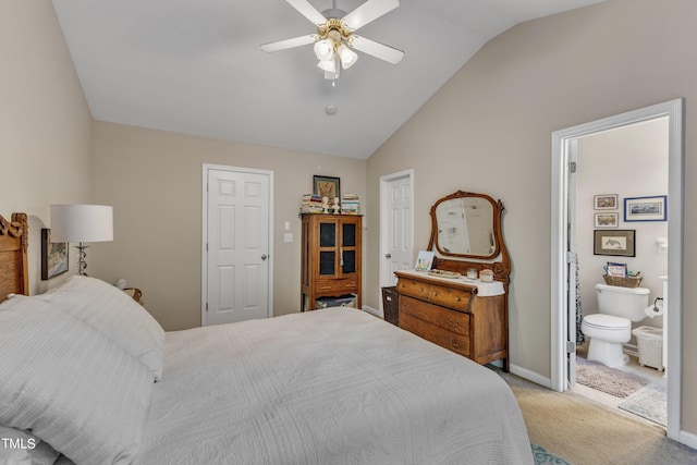 bedroom with ceiling fan, lofted ceiling, ensuite bathroom, light carpet, and baseboards