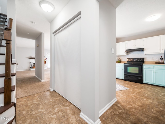 hallway featuring stairway and baseboards