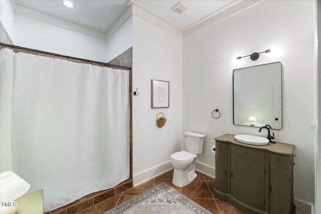 bathroom with tile patterned flooring, toilet, visible vents, vanity, and crown molding