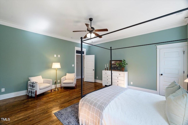 bedroom with ornamental molding, wood finished floors, a ceiling fan, and baseboards