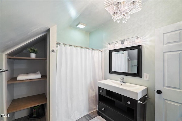 full bathroom featuring vanity and an inviting chandelier