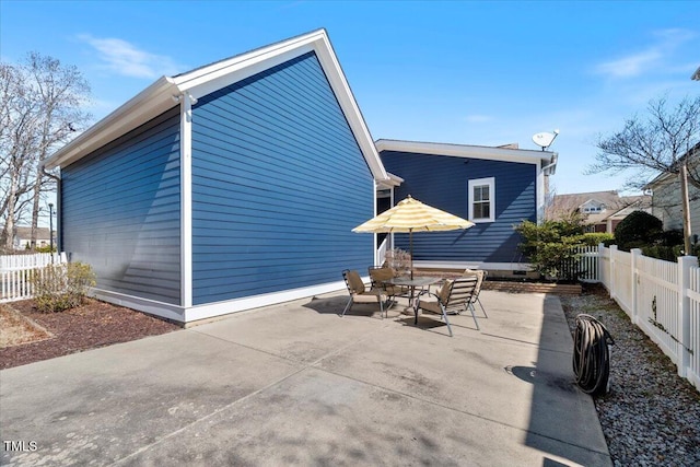 exterior space with fence private yard and a patio area