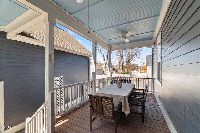 wooden deck featuring ceiling fan and outdoor dining area