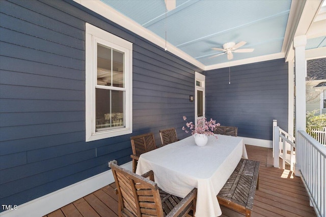 wooden deck with ceiling fan and outdoor dining space