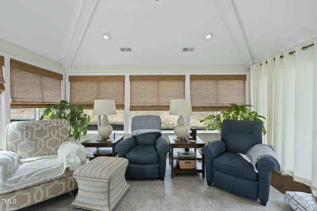 sunroom / solarium featuring visible vents and vaulted ceiling with beams