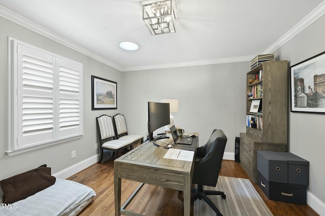 office space with visible vents, ornamental molding, baseboards, and wood finished floors