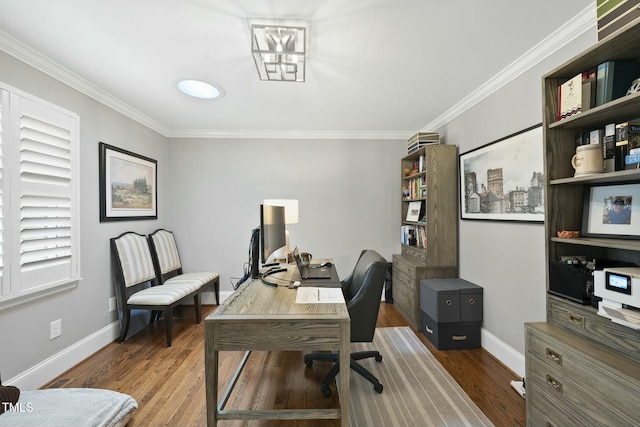 home office featuring crown molding, wood finished floors, and baseboards