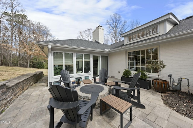 view of patio featuring a sunroom