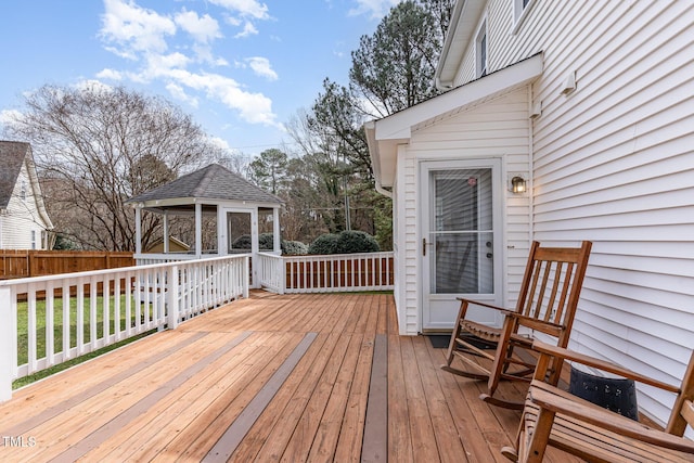 deck with a gazebo and fence