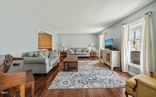 living room with baseboards and wood finished floors