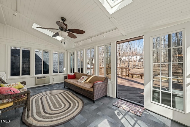 sunroom with lofted ceiling with skylight, wood ceiling, a wall unit AC, and ceiling fan