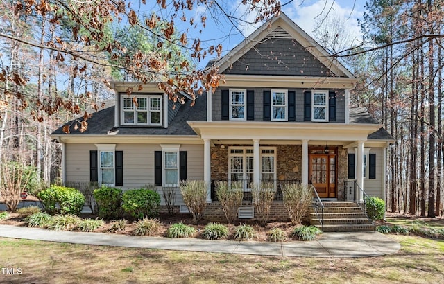 view of front facade featuring covered porch, crawl space, and roof with shingles