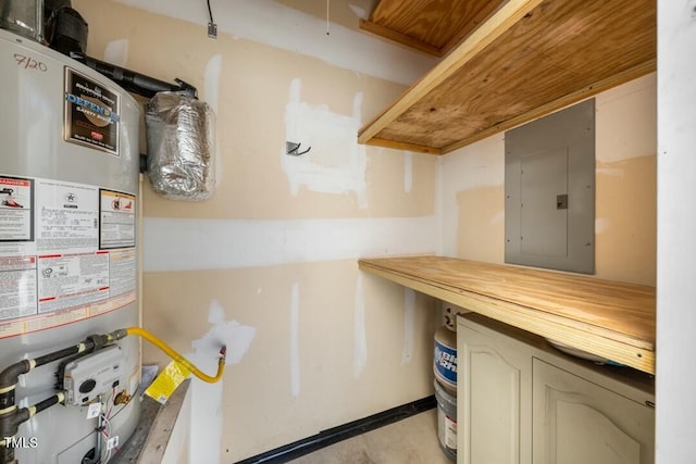 interior space featuring butcher block counters, gas water heater, and electric panel