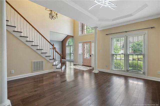 entryway with visible vents, stairway, ornate columns, and hardwood / wood-style flooring