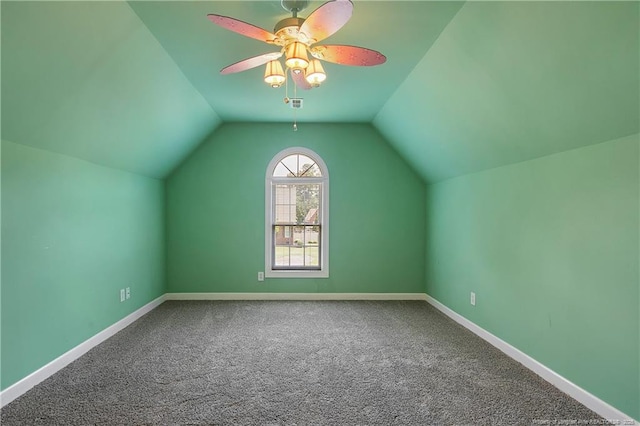 additional living space with visible vents, baseboards, lofted ceiling, ceiling fan, and carpet