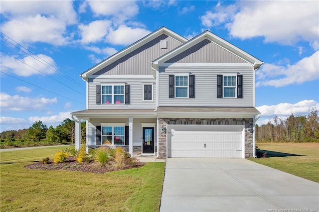 view of front of property with a garage, concrete driveway, board and batten siding, and a front yard