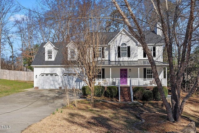 view of front of property with fence, covered porch, and driveway