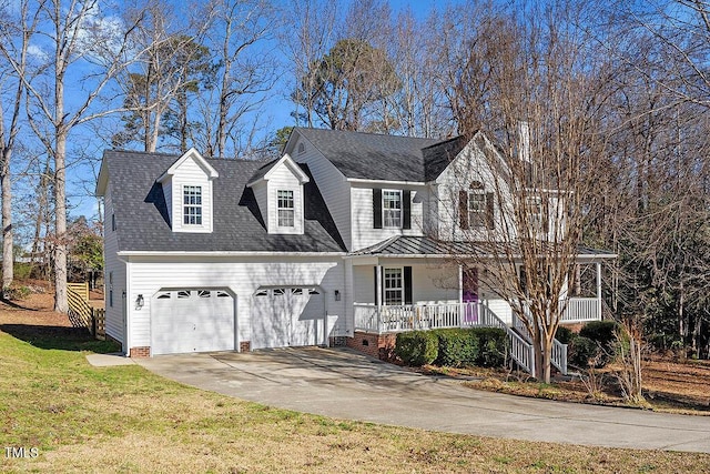 view of front of house featuring covered porch, concrete driveway, a front yard, a shingled roof, and a garage