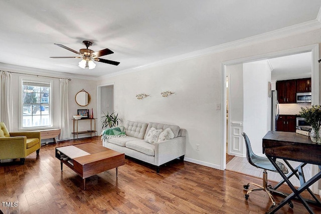 living area featuring crown molding, ceiling fan, and wood finished floors